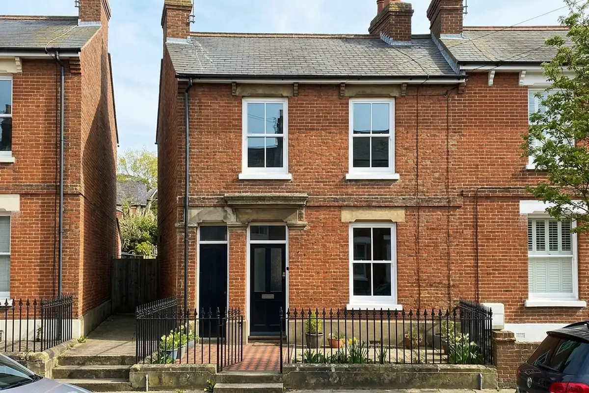 Illustration of a Victorian terraced house with three new white sash windows